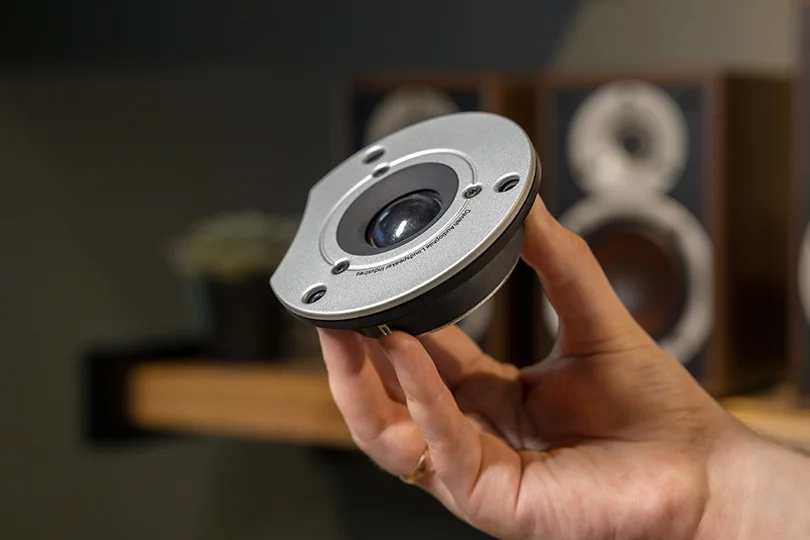 Hand Holding a Speaker Part